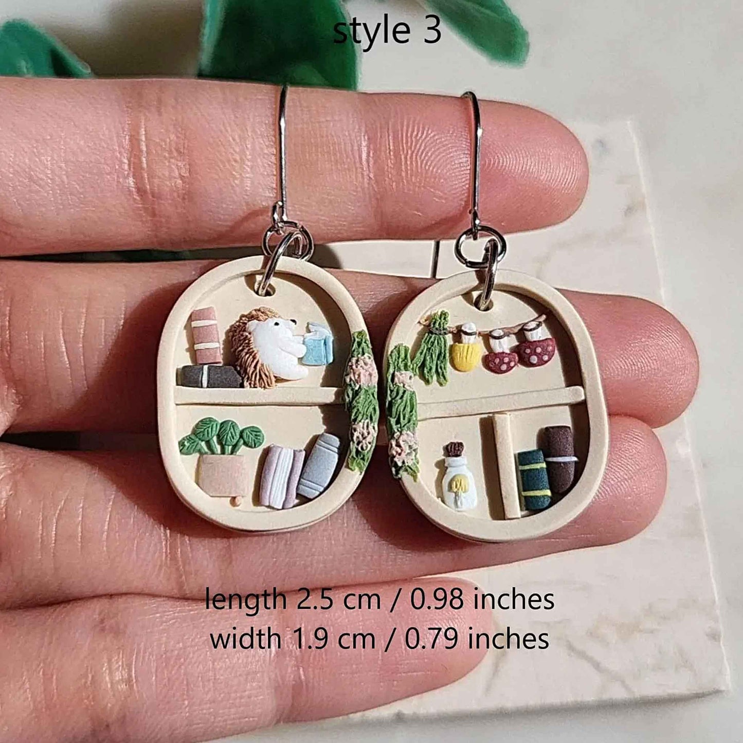 Cottagecore bookshelf earrings and plants