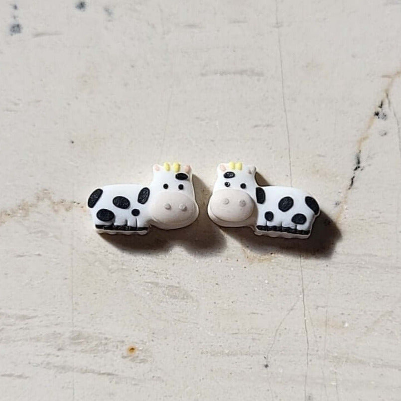 Tiny cow stud earrings