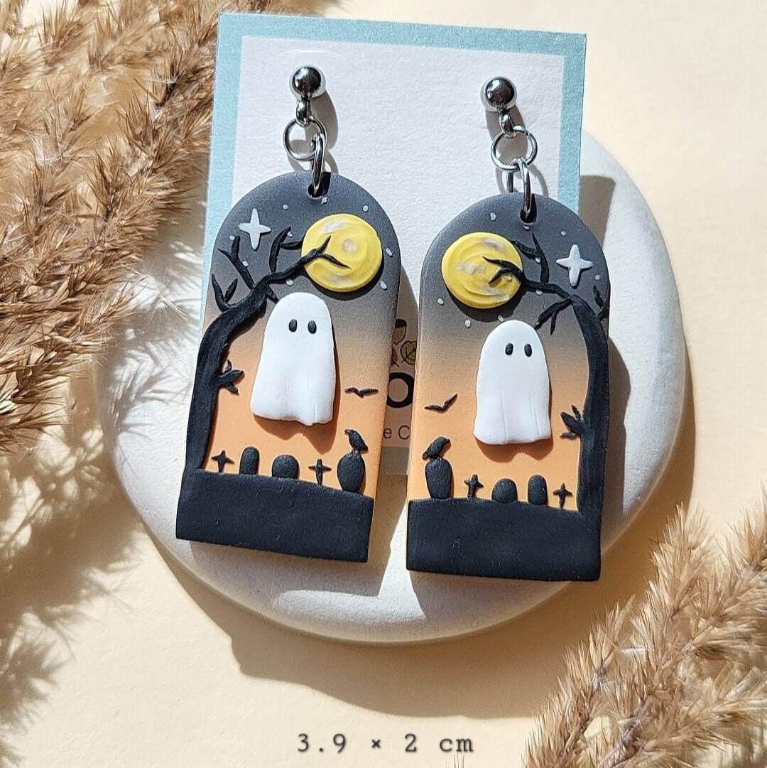 Cute Halloween ghost earrings in cemetery