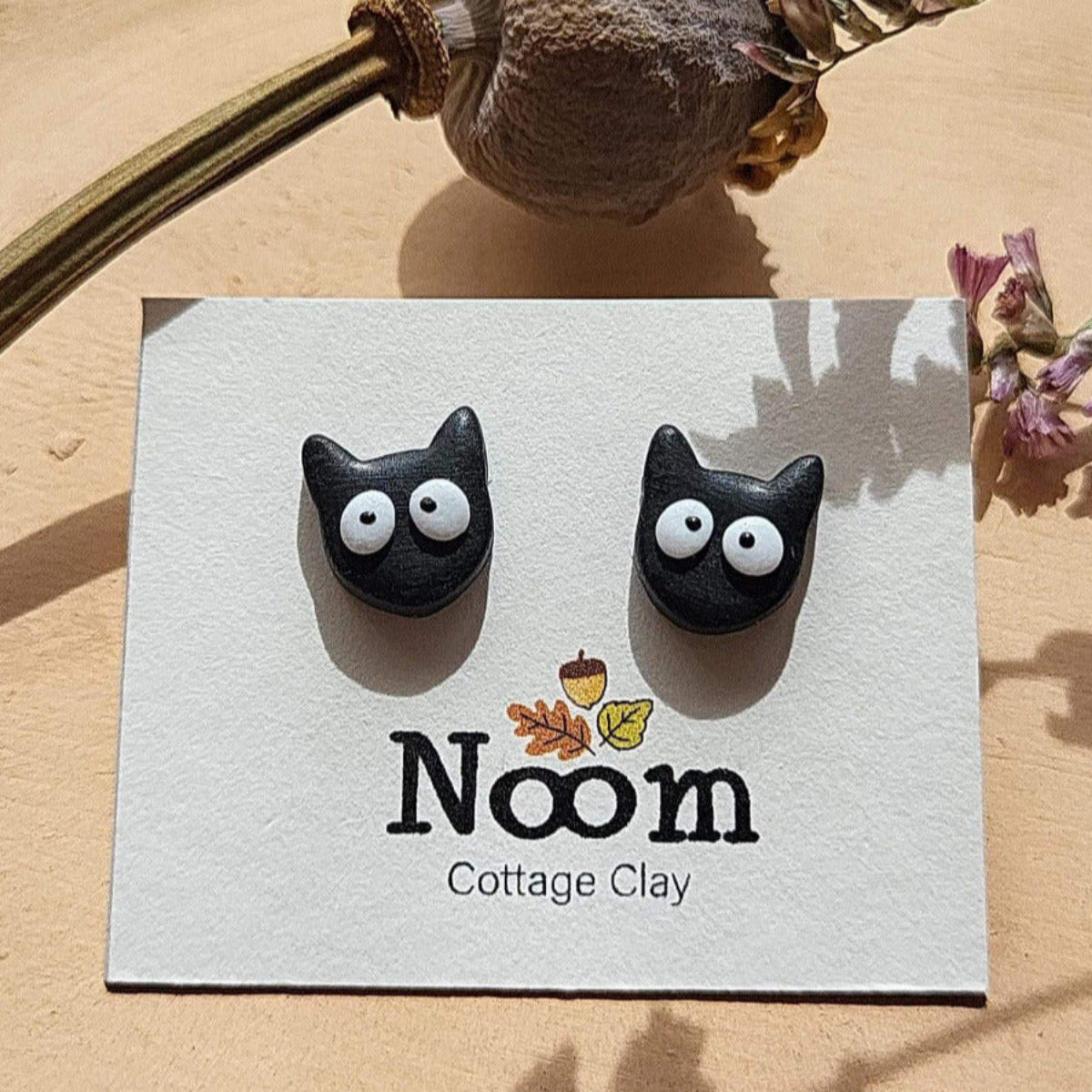 Small funny black cat stud earrings