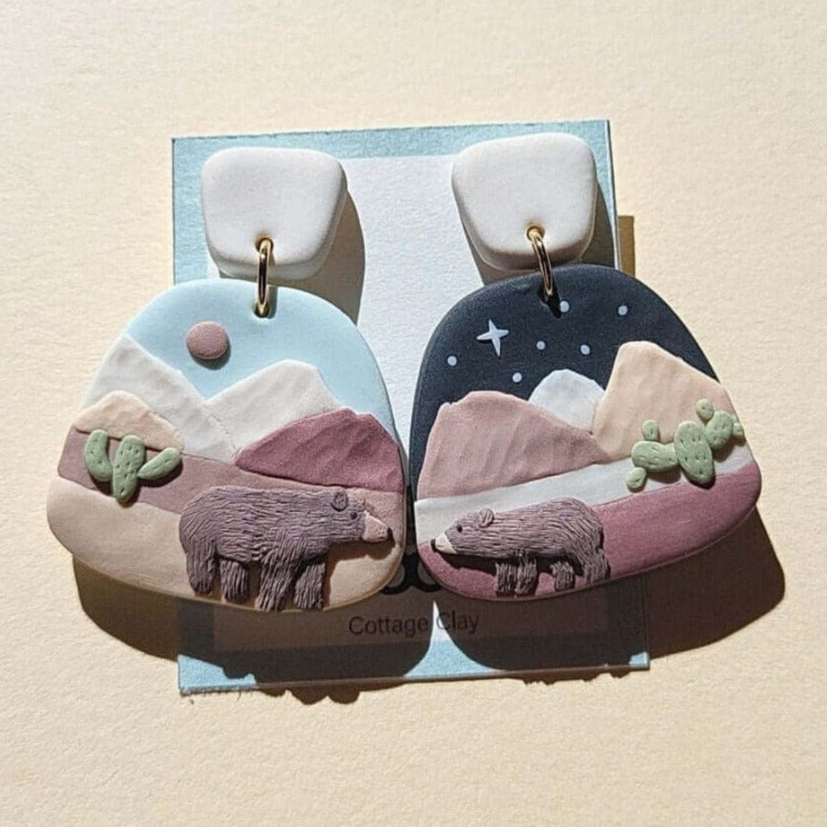 Grizzly bear earrings in desert