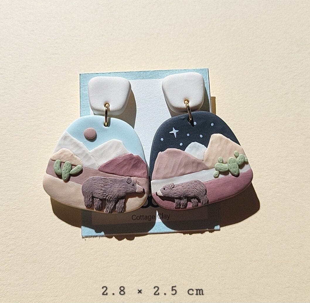 Mountain landscape earrings with brown bear