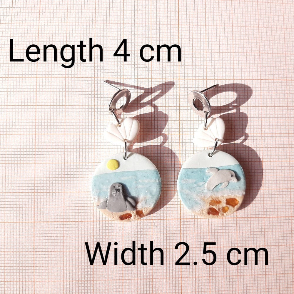 Dolphin And Seal Earrings With Natural Amber Stone