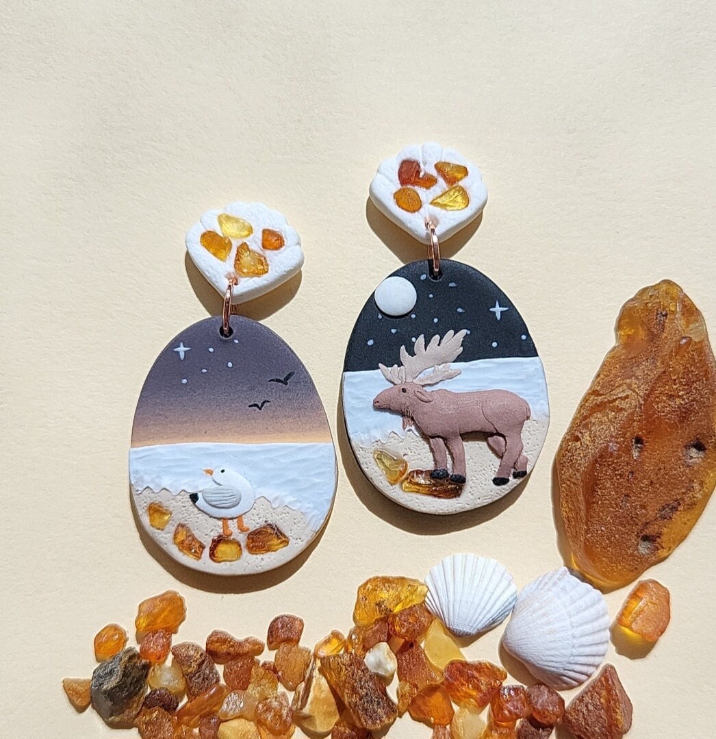 Moose and seagull earrings with amber stone