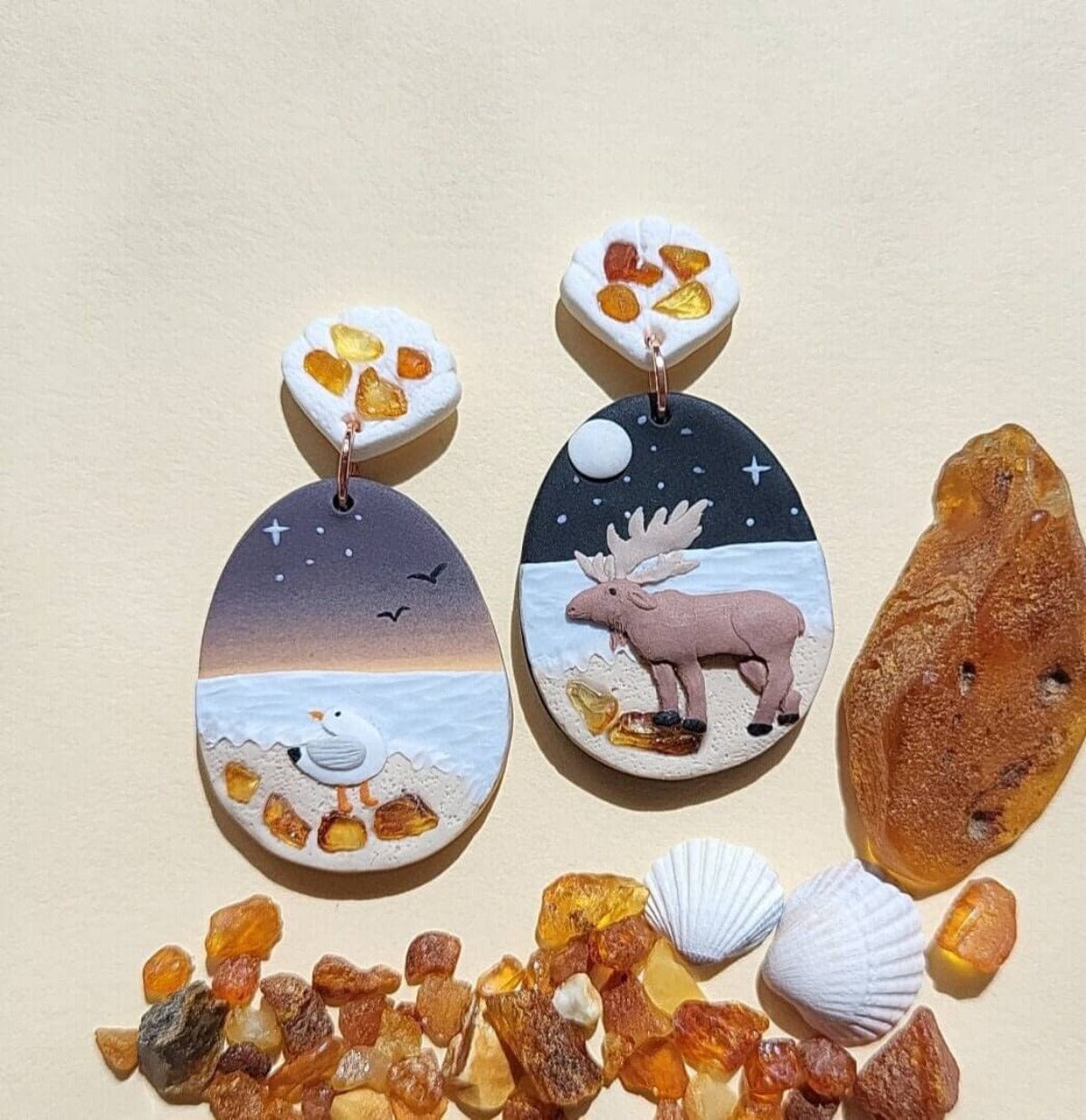 Moose and seagull earrings with amber stone