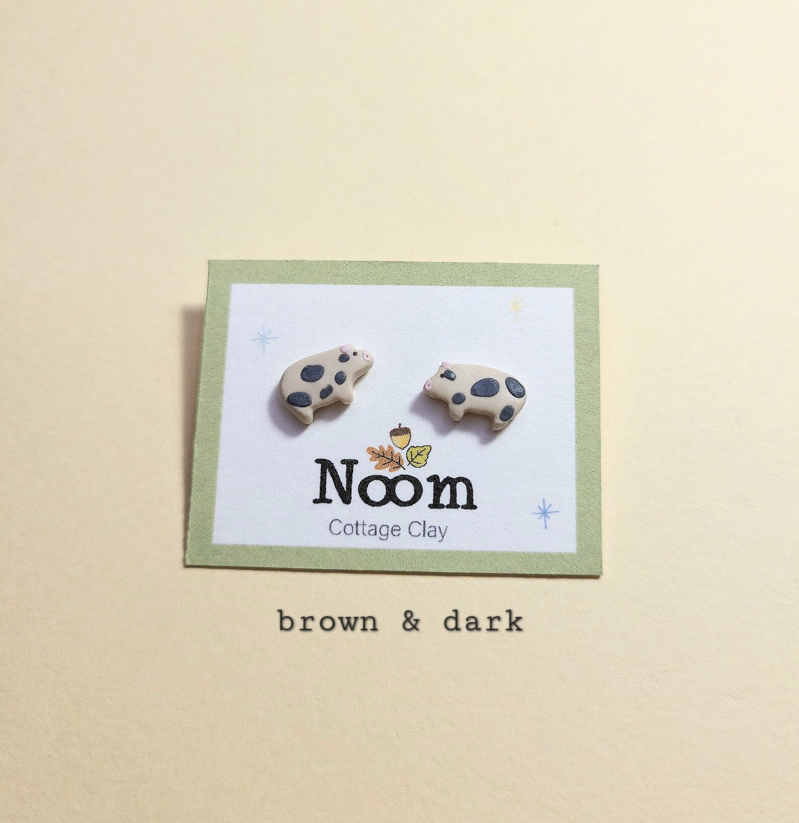 Brown pig stud earrings