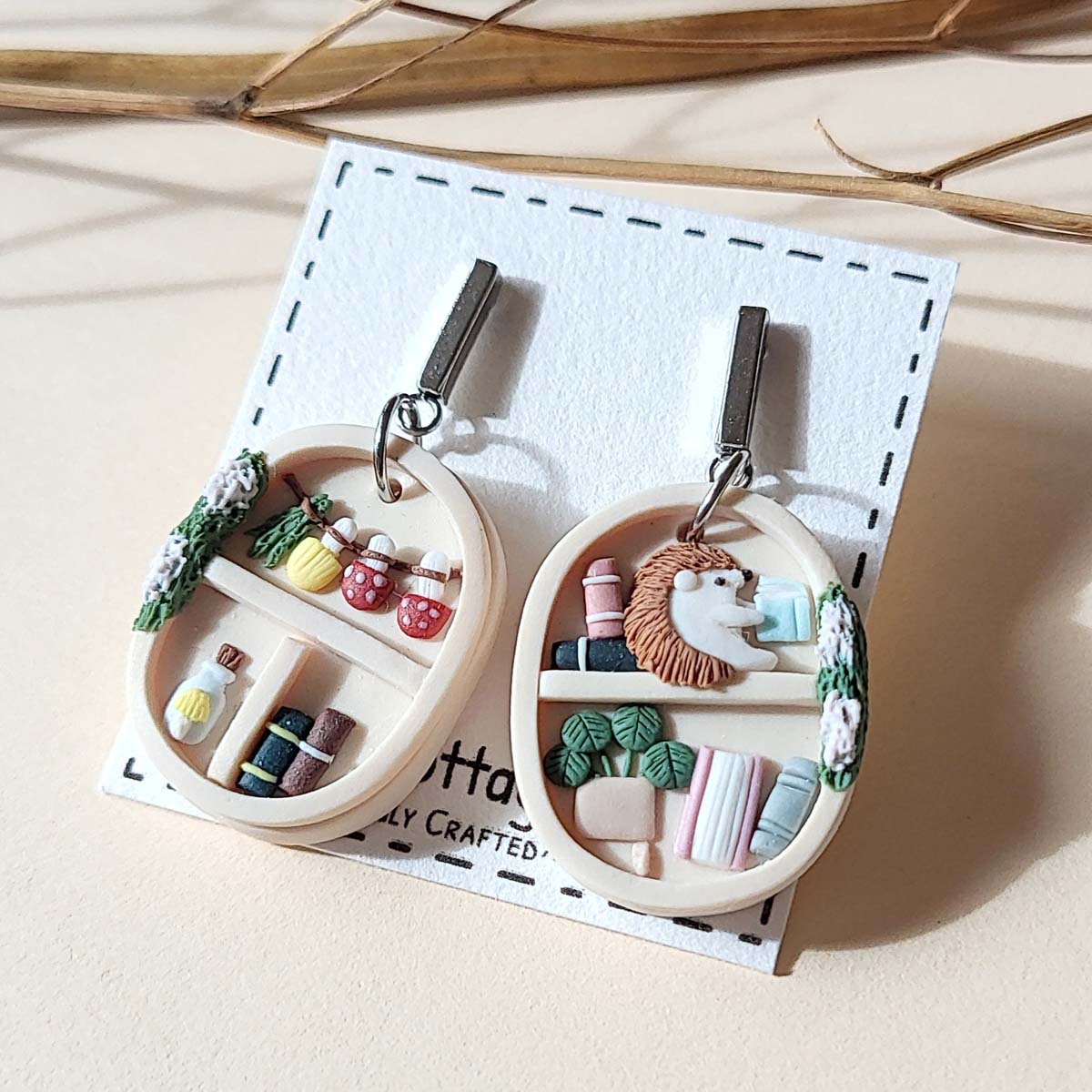 Cute cottagecore bookshelf  and plant polymer clay earrings with hedgehog