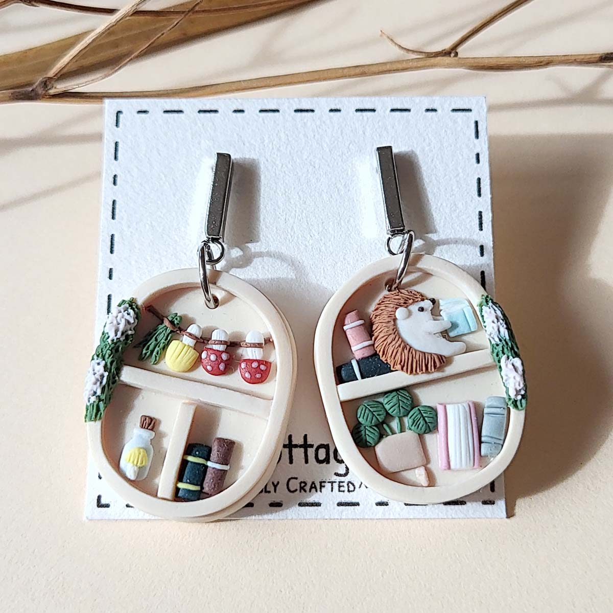 Handmade whimsical bookshelf  and plant polymer clay earrings with hedgehog