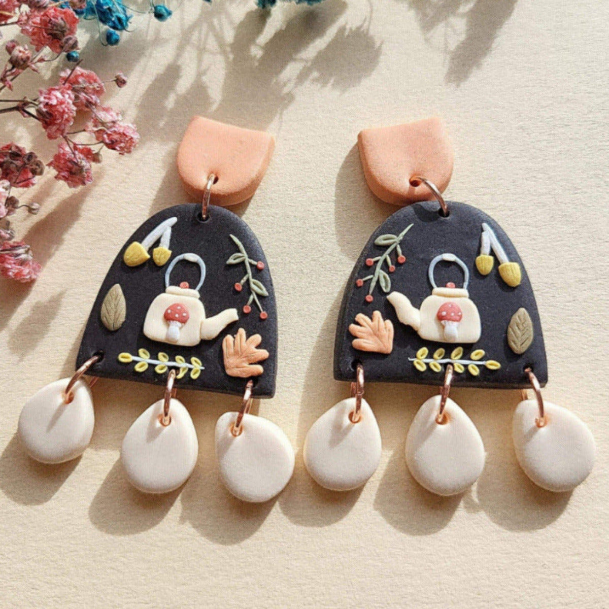 Mushroom Teapot Earrings in cottagecore style are handmade from polymer clay with stainless steel surgical ear posts and backings.