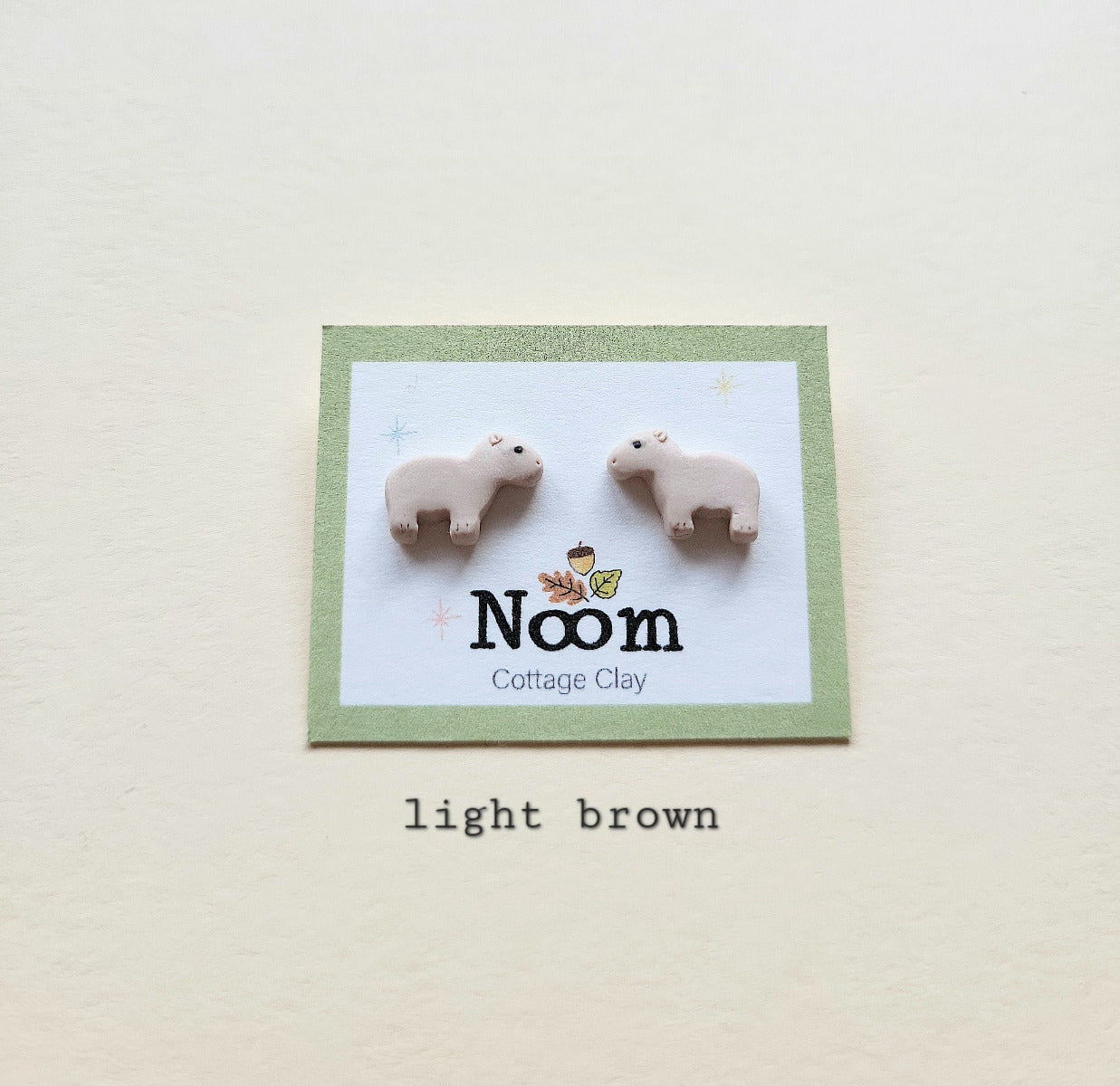 Small capybara stud earrings