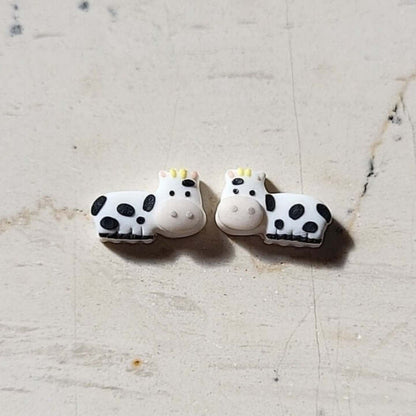 Tiny cow stud earrings