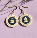 Cute ghost earrings in photo frame