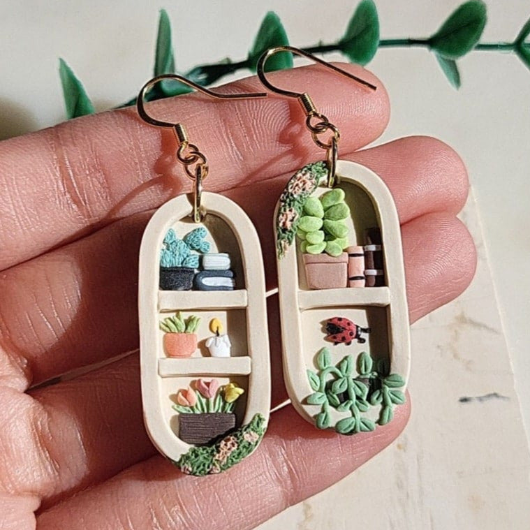 Handmade bookshelf and plant earrings