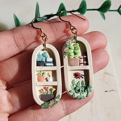 Handmade bookshelf and plant earrings