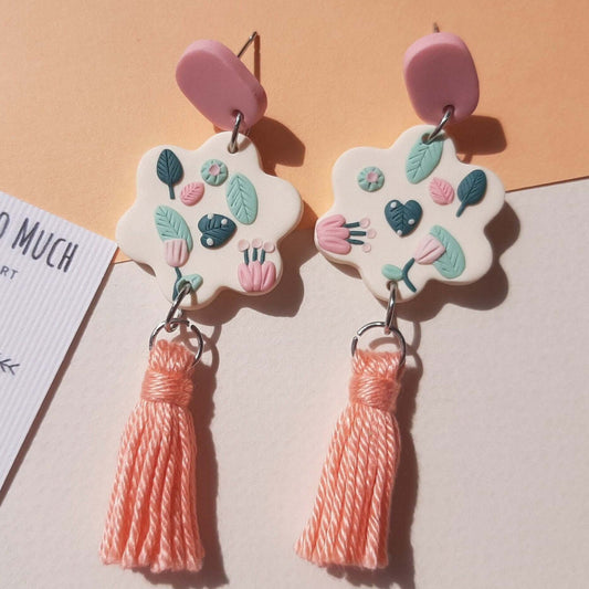 Dangle leaf earrings with cotton tassels