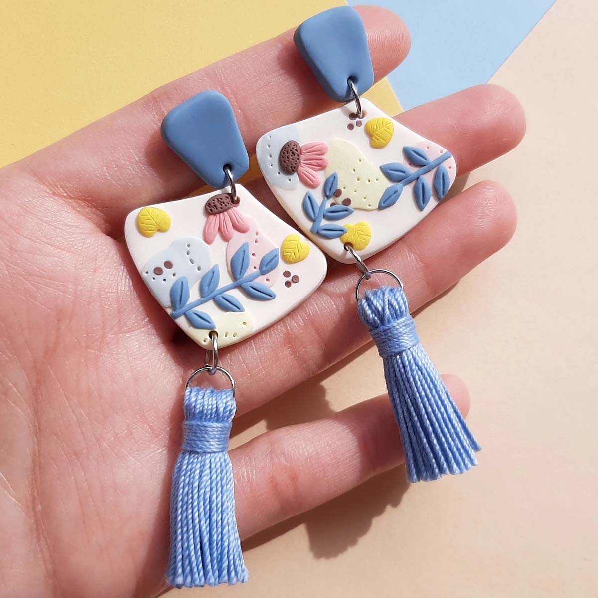 Handmade dangle boho flower earrings with a cotton blue tassel – unique earrings for everyday wear or cute gift for women. Rankų darbo auskarai su gėlėmis ir mėlynu kutu