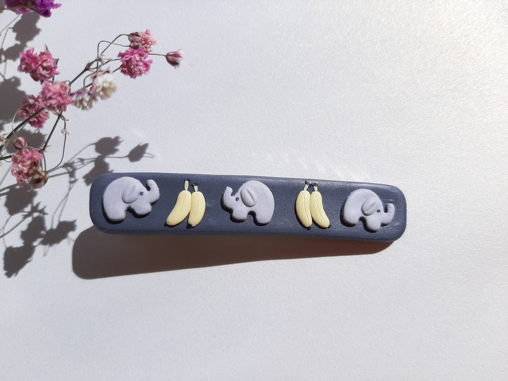 Pince à cheveux en pâte polymère éléphant et banane