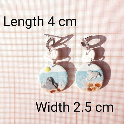 Dolphin And Seal Earrings With Natural Amber Stone