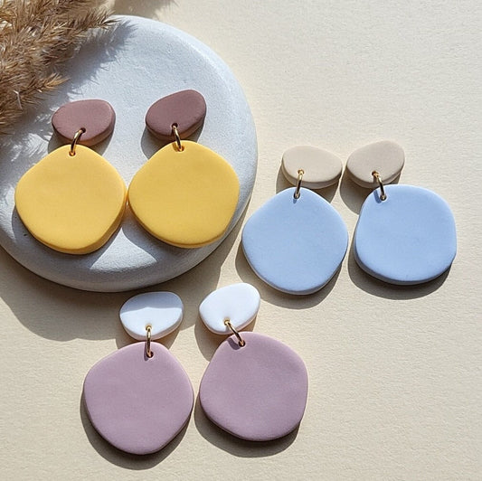 minimalist pebble earrings in yellow, blue and magenta colors