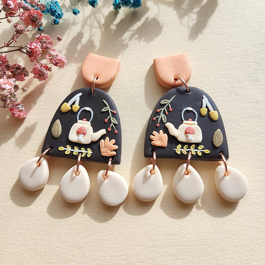 Mushroom Teapot Earrings in cottagecore style are handmade from polymer clay with stainless steel surgical ear posts and backings. 