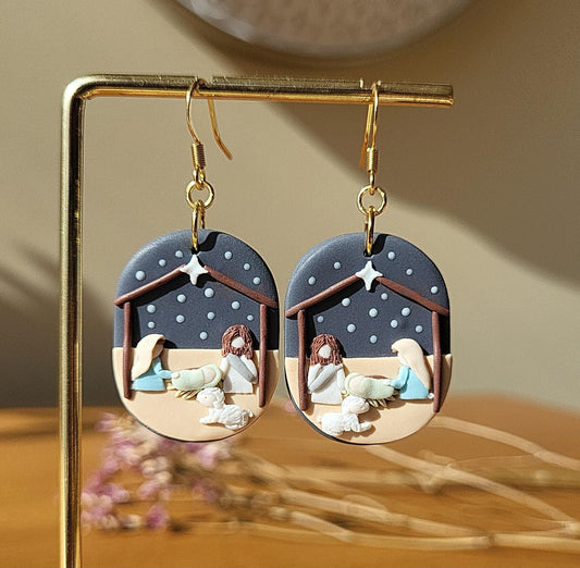 The nativity scene earrings with lamb are handmade from polymer clay with surgical stainless steel ear hooks. They are a cute unique Christmas gift for Christian women.