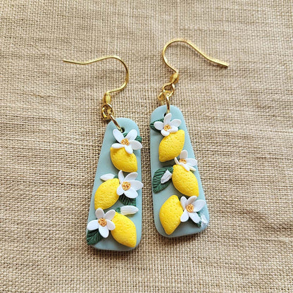 Handmade lemon and white flower polymer clay earrings - Rankų darbo auskarai su citrinų ir gėlių motyvais.