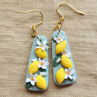 Handmade lemon and white flower polymer clay earrings - Rankų darbo auskarai su citrinų ir gėlių motyvais.
