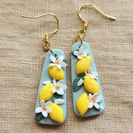 Handmade lemon and white flower polymer clay earrings - Rankų darbo auskarai su citrinų ir gėlių motyvais.