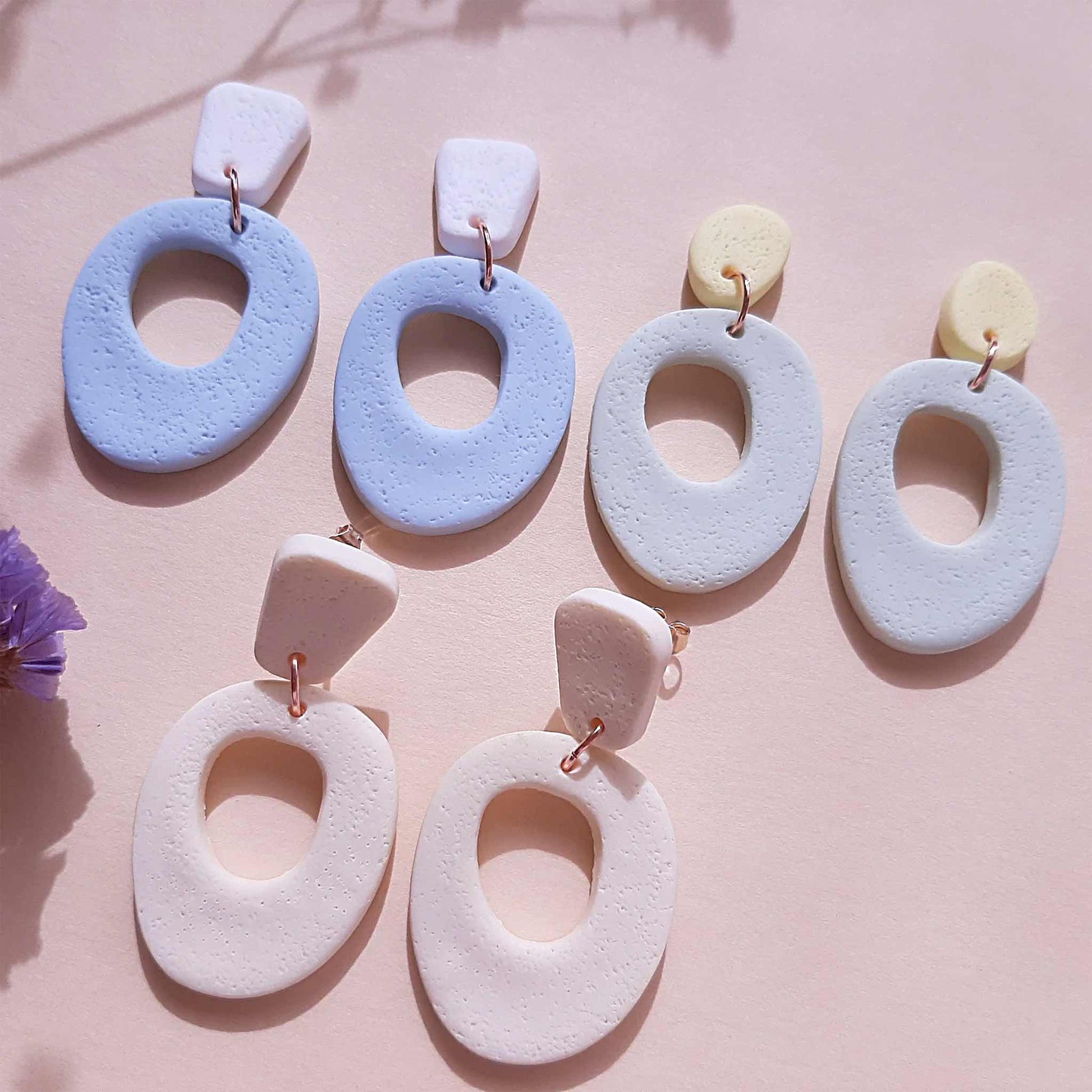 Minimalist polymer clay earrings in pastel colors, blue, lime green and cream 