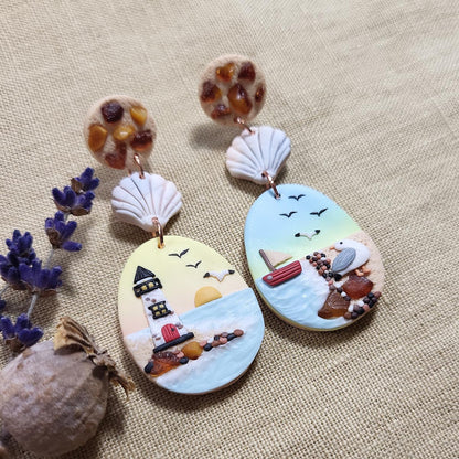 Dangle ocean seagull earrings with natural amber stone. Rankų darbo auskarai su jūra, gintaru ir kiru