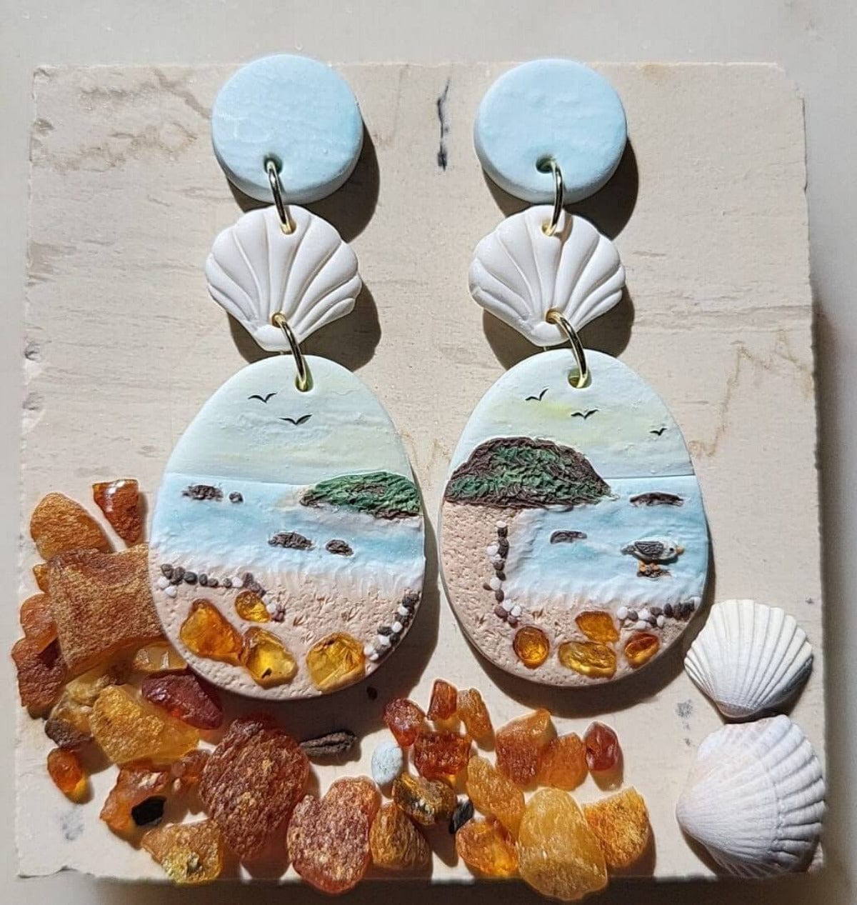Dangle ocean earrings with amber stone