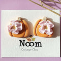 Pumpkin stud earrings with flower