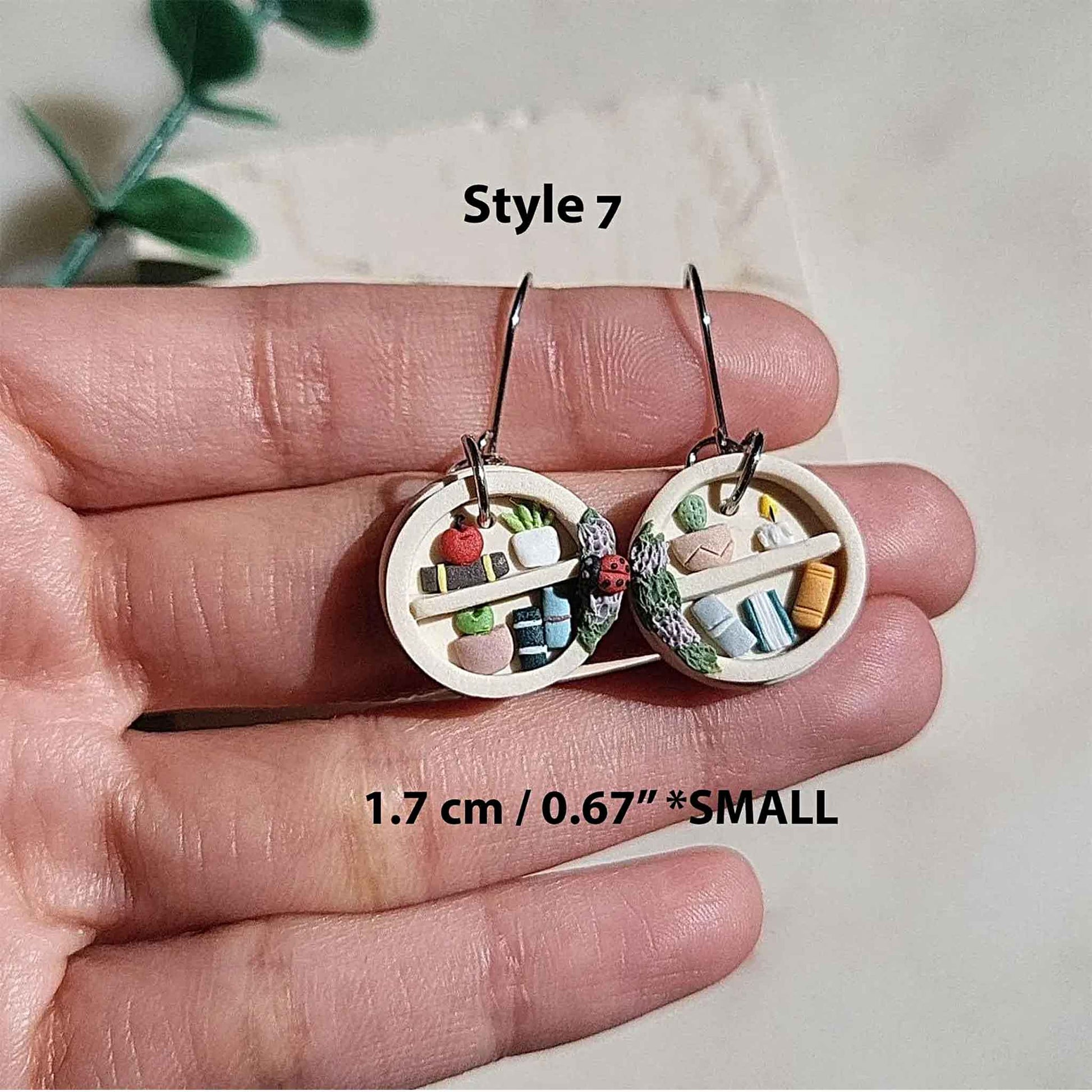 Small dangle bookshelf earrings and plants