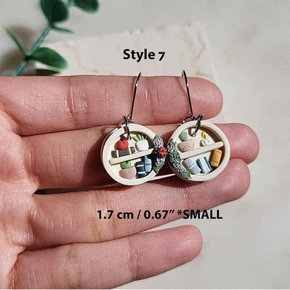 Small dangle bookshelf earrings and plants